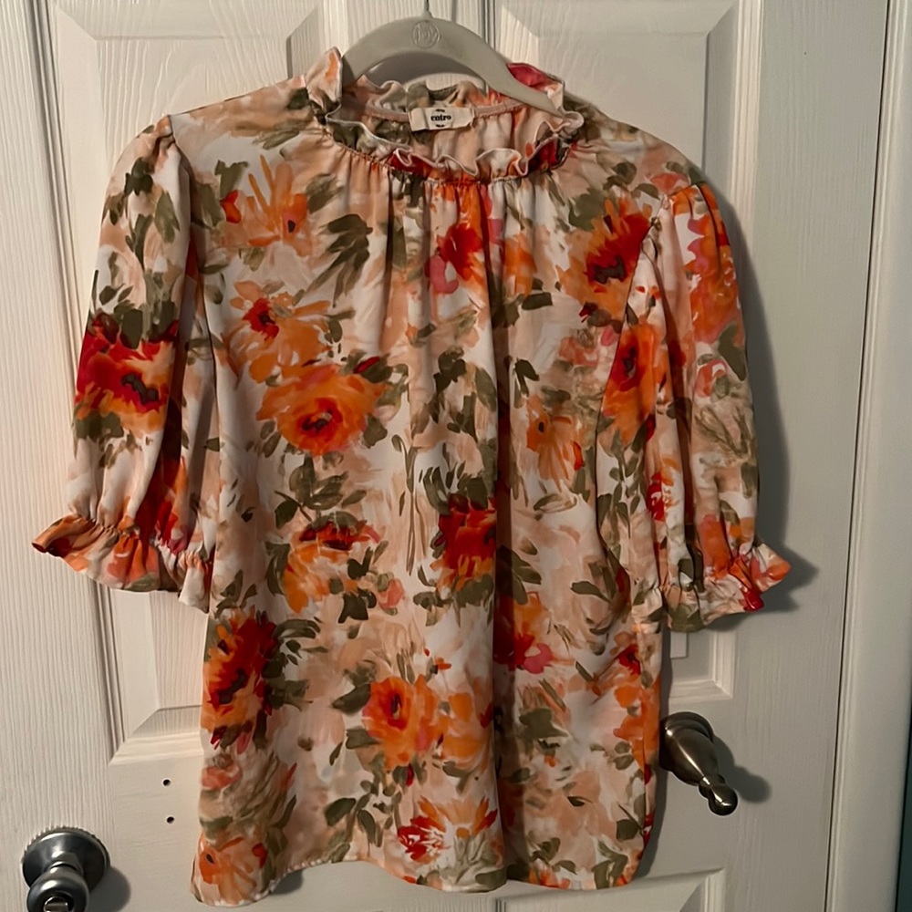 Orange floral ruffle top. Size large